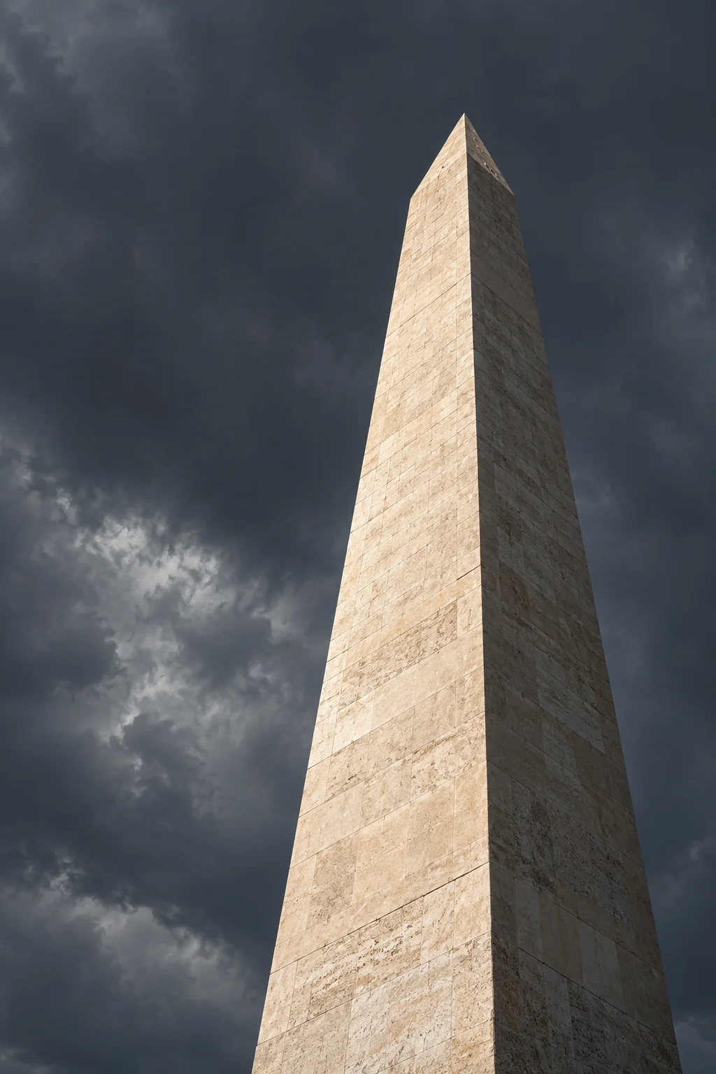 A limestone obelisk rising against a charcoal sky